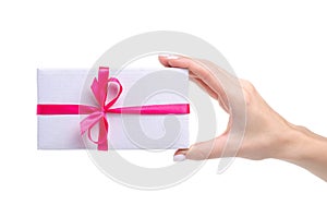 White box with pink ribbon bow gift in hand