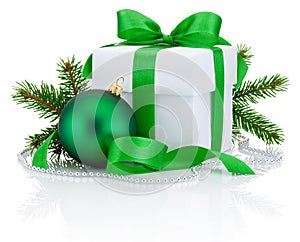 White box tied green ribbon bow, pine tree branch and christmas ball