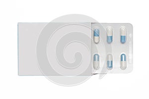 White box with white-blue capsules in a blister pack