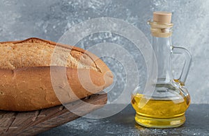 White bread with oil on the wooden board