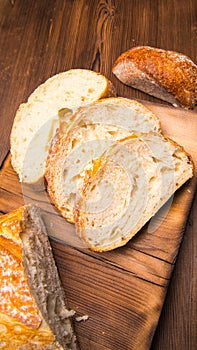 White bread sliced on a chopping Board close-up,with space