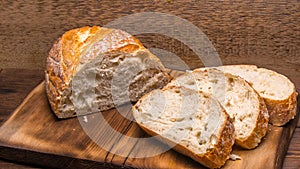 White bread sliced on a chopping Board close-up,with space