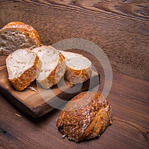 White bread sliced on a chopping Board close-up,with space