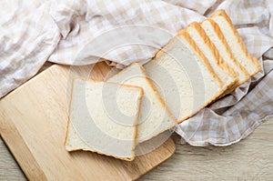 White bread on wood table for morning breakfast