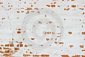 White brick wall, grunge texture background. The texture of the old brick wall is painted white with paint.