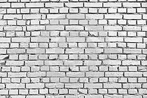 White brick wall texture background. Old weathered and cracked bricks. Close up