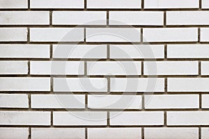 White brick wall texture with dark spaces