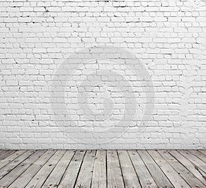 White brick wall and wood floor.