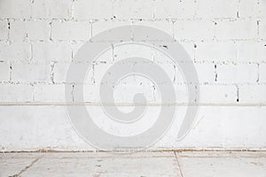 White brick wall and wood floor background