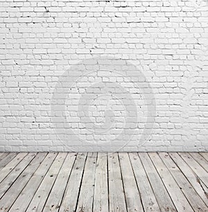 White brick wall and wood floor.