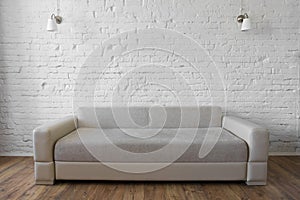 White brick wall wooden floor beige sofa loft