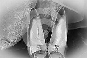 White bridal shoes at a wedding photo