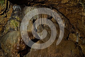 White broad stalagmite in cave