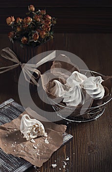 White broken meringue and dry roses