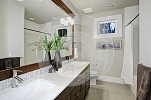 White and brown bathroom design in brand-new home