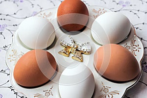 White and brown eggs on a special plate natural color. Preparation for Easter. Diet and Healthy eating