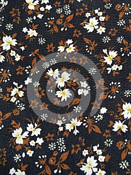 White and brown floral fabric background