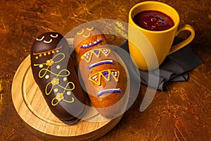 White and brown guaguas de pan with colada morada. Ecuadorian traditional food on the day of the dead