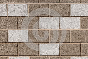 White and brown painted brick blocks pattern stone wall exterior city texture background