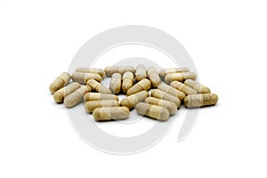 White or brown pills or capsule isolated on white background. Group of object. Medicine, food supplement or herb for cure