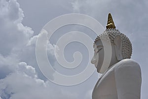 white buddha image in temple thailand on cloud sky background is