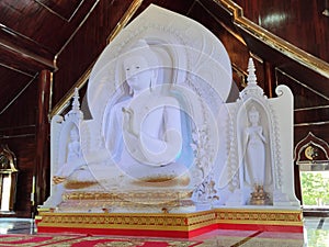White buddha sculpture in temple Thailand.
