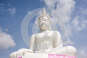 White Buddha and sky Located near Pa Sak Jolasid Dam Thailand.