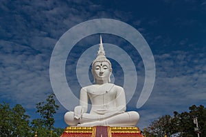 The white buddha statue  with sky background