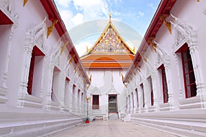 The white buddishm temple which have a blue sky background