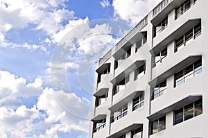 White Building, Blue Sky with Clouds