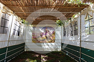 A white building of a public Sukkah, before the Sukkot holiday