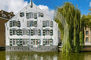 A white building by the river Nete in Lier, Belgium