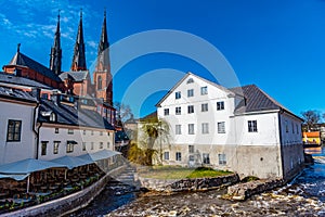 White building of Uppland museum and cathedral in Uppsala, Sweden