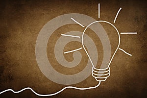 A white bulb on a textured background, symbol for idea, creativity, business, planing