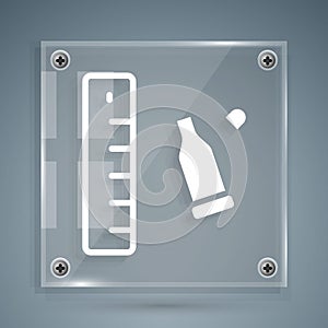 White Bullet casing as a piece of evidence placed with forensic ruler for documentation icon isolated on grey background