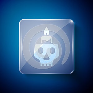 White Burning candle on a skull icon isolated on blue background. Day of dead. Square glass panels. Vector