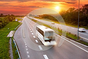 White bus in the rush hour on the highway