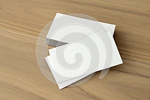 White business card on wood table background