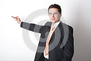 White business man pointing at blank space