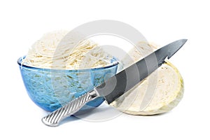 White cabbage head of cabbage and sliced in bowl and knife