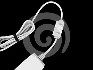 White cable bent and coiled up and held with black rubber band with electric adapter on the end