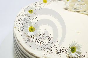 White cake with many flowers