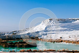 White calcium limestone landscape and thermal pool in Pamukkale, Denizili, Turkey