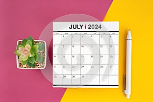 White calendar for July 2024 and pen on beautiful background