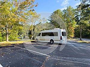 A white camper van in a parking lot near Tallulah Falls, Georgia USA