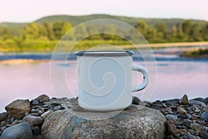 White campfire enamel mug mockup with sunrise river view
