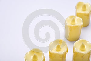 White candle on white background isolated. Set of  candle.Small candle with light yellow spots on light background. Christmas
