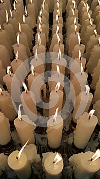 White candles offering worship.