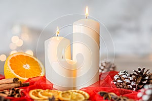 White candles and orange
