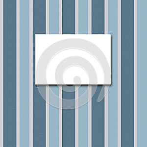 White canvas frame on a blue striped wallpaper.